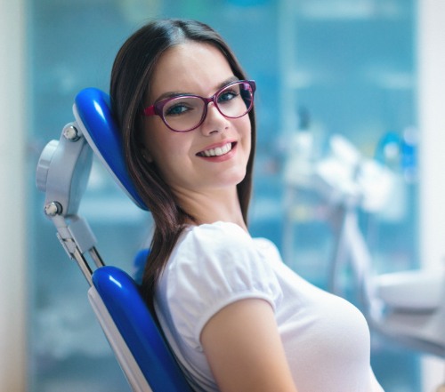 Woman smiling after dental crown restoration