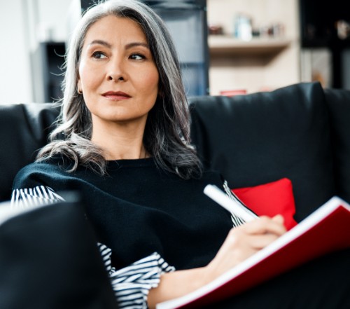 Woman discussing all on four dental implant options during consultation