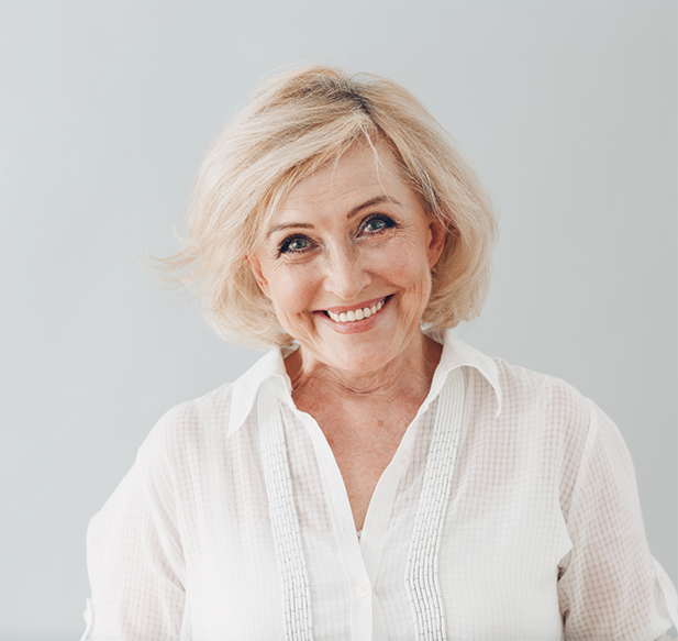 Senior woman smiling after getting All-on-X dental implants in Cocoa Beach