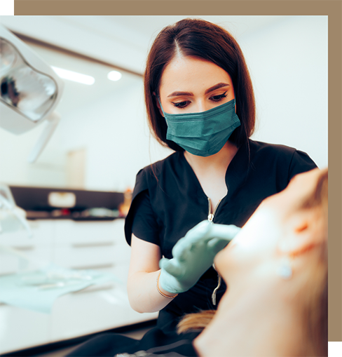 Dentist closely examining a patient's mouth