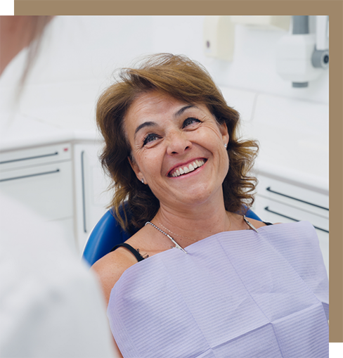 Woman looking gratefully at her dentist