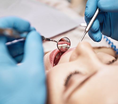 a patient undergoing a dental checkup in Cocoa Beach