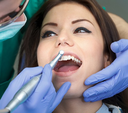 a patient receiving a dental cleaning in Cocoa Beach