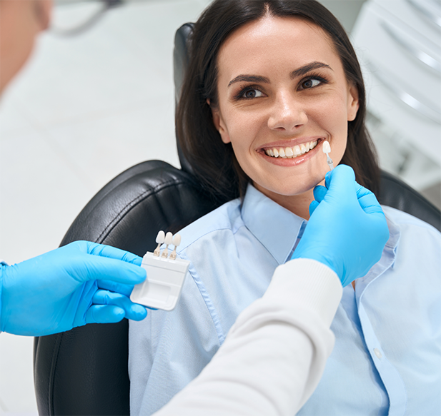 Woman trying on veneers from her cosmetic dentist in Cocoa Beach