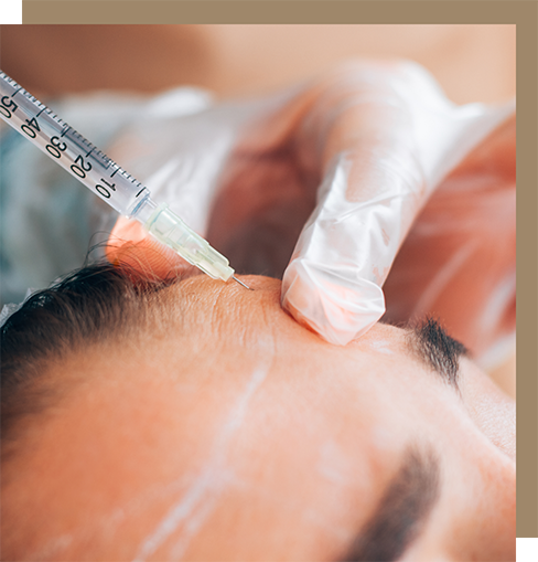 Man getting injection in his forehead