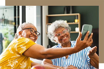 Two older women taking a selfie