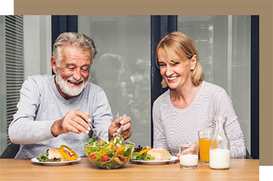 Senior man putting salad on his plate