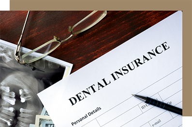 Dental insurance paperwork and pen on a desk