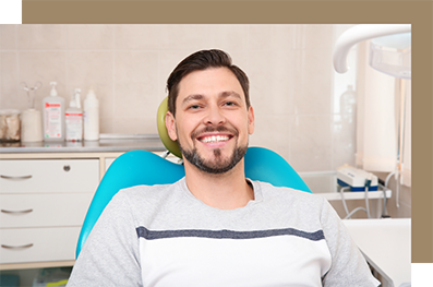 Young man sitting expectantly in the dental chair