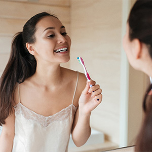 Woman brushing her teeth