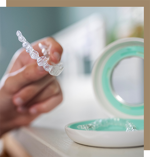Taking a clear aligner out of its case