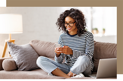 Smiling woman typing on her phone