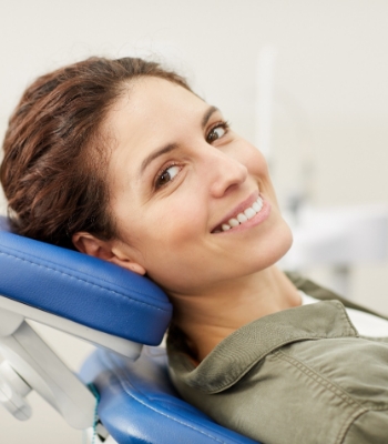 Woman with brown hair undergoing dental exam