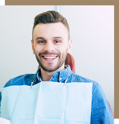 Young man in a denim jacket at the dentist