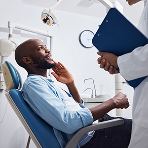 Man preparing to swallow a sedative medication