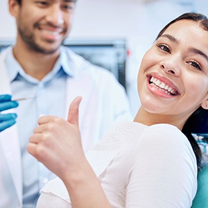 Happy patient making thumbs-up gesture