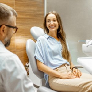 Smiling woman visiting emergency dentist in Cocoa Beach for checkup