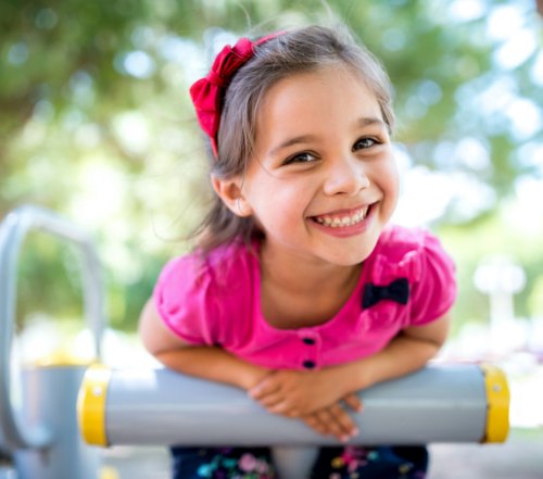Little girl smiling after receiving dental sealants