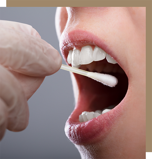 Dental patient having a saliva sample taken