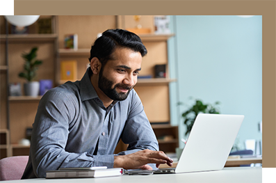 Man at a desk using a laptop