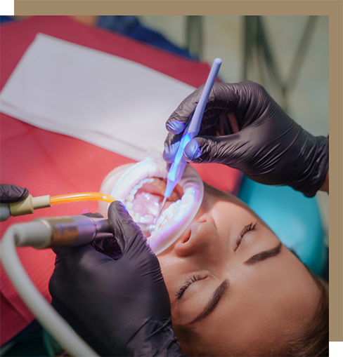 Dentist and assistant treating a patient