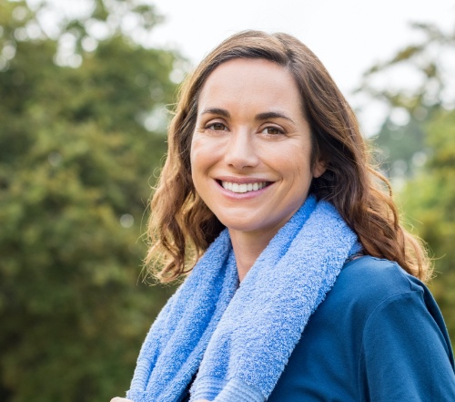 Woman sharing healthy smile after scaling and root planing