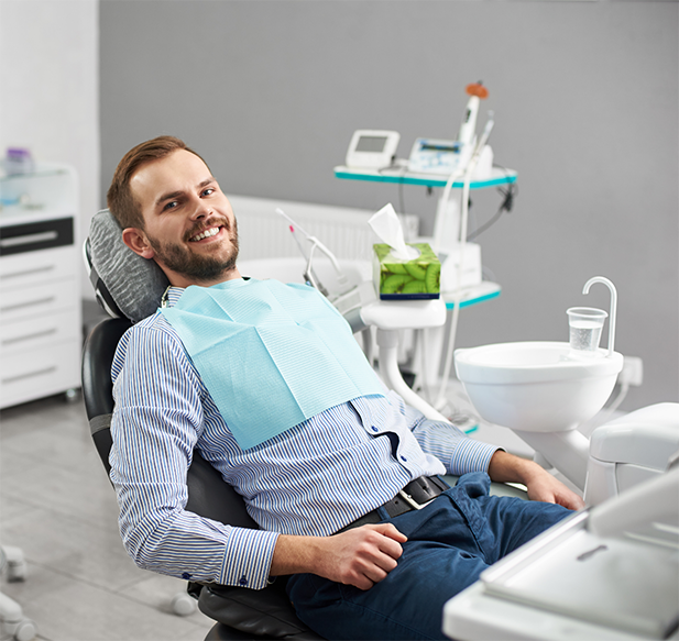 Man in the dental chair waiting for scaling and root planing