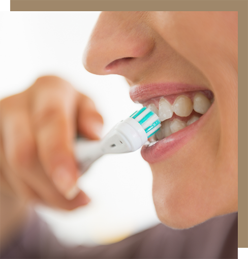 Person using an electric toothbrush