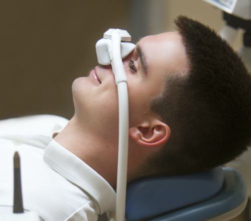 Patient with nitrous oxide dental sedation mask in place