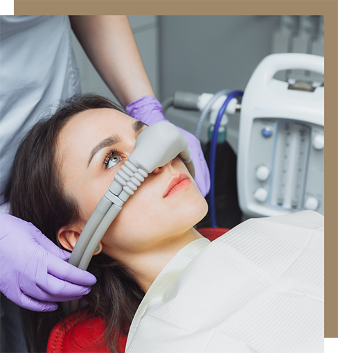 Woman in dental chair with nitrous oxide mask