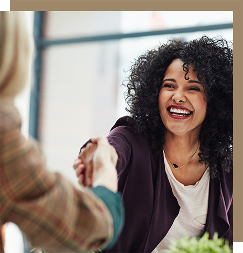 Woman shaking hands at a job interview