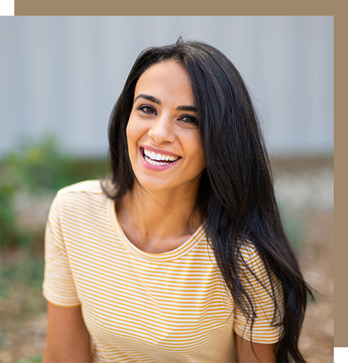 Woman with long black hair smiling