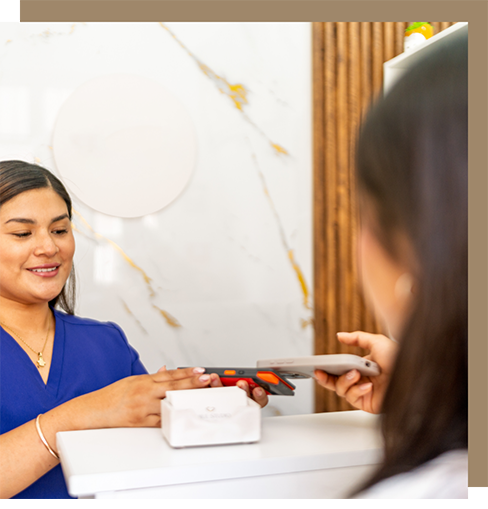 Person paying for their dental treatment
