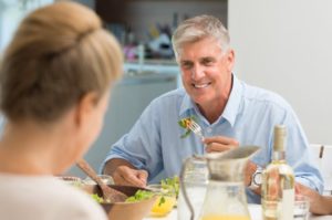 senior man eating food