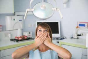 woman afraid of dental chair 