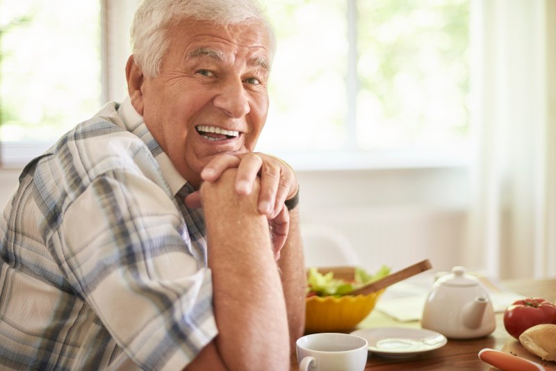 older man smiling after All-On-4 surgery