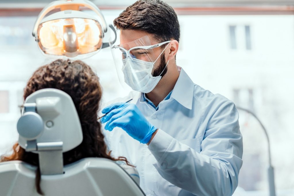 person receiving care from emergency dentist
