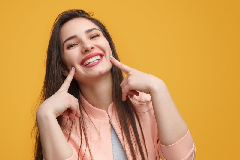 Lady shows pretty teeth