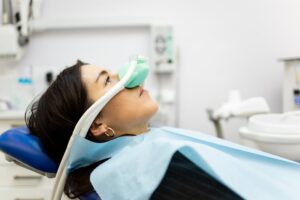 Woman who's awake while getting nitrous oxide during her dental visit