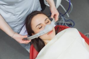 Woman receiving nitrous oxide for her dental visit