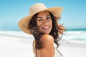 Woman at the beach with a gorgeous smile