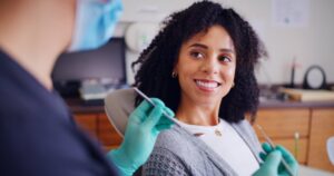 Woman at her full mouth reconstruction consultation